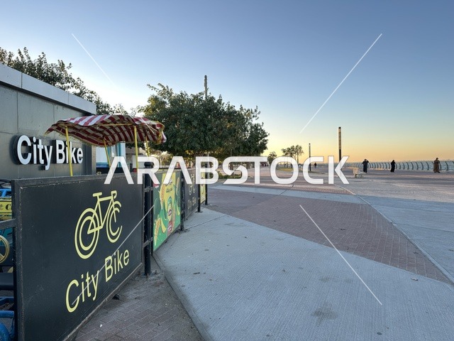 Riding a bike on the waterfront promenade in the city of Dammam, a vibrant area and a main outlet for residents and visitors of the Eastern Province, a corniche overlooking the Arabian Gulf in the Kingdom of Saudi Arabia.