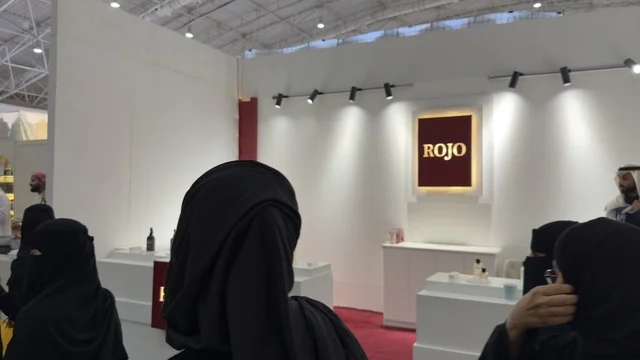 A booth or pavilion bearing a sign with the name "Rogo" for the Blue Oud and International Perfumes Exhibition in Riyadh, held from December 2025 to January 2026 in the Kingdom of Saudi Arabia, featuring major annual events that offer a sensory experience including shopping, learning about the perfume industry, and workshops.