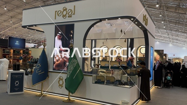 The flag of the Kingdom is in front of the pavilion at the Blue Oud and International Perfumes Exhibition in Riyadh, held from December 2025 to January 2026 in the Kingdom of Saudi Arabia. It features major annual events that offer a sensory experience including shopping, learning about the perfume industry, and workshops.