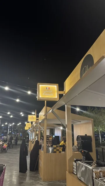 The Italian section at the Luqma event in Jeddah in January 2026, traditional Hijazi sweets and pastries, a luxurious tasting experience in the Kingdom of Saudi Arabia, a family and popular atmosphere, tasting the flavor of traditional local food.