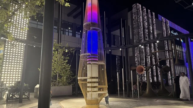 A luxurious tasting experience in the Kingdom of Saudi Arabia, an event called "Luqma" in the city of Jeddah in January 2026, featuring traditional Hijazi sweets and baked goods, a family-friendly and popular atmosphere, tasting the flavors of traditional local cuisine.