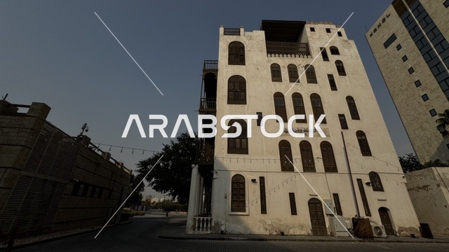 The historical buildings in the historic district of Jeddah, Saudi Arabia, the ancient Arab architectural design, the alleys of the historic district in Jeddah, the archaeological buildings, the historical landmarks in Jeddah, tourism in Saudi Arabia.