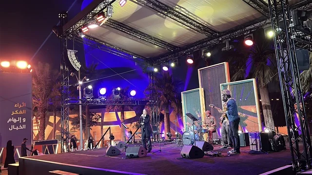 A musical and singing performance at a food festival in the outdoor gardens of Ithra in Dhahran, Eastern Province, Saudi Arabia, on December 28, 2025. A global tasting experience, enjoyable outdoor sessions, international and local restaurants, family-friendly and entertaining atmosphere.