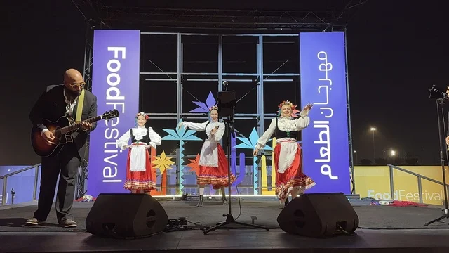 A musical performance and Mexican folk dance at a food festival in the outdoor gardens of Ithra in Dhahran, Eastern Province, Saudi Arabia, on December 28, 2025. Enjoyable outdoor sessions, a global food experience, international and local restaurants, and a family-friendly and entertaining atmosphere.