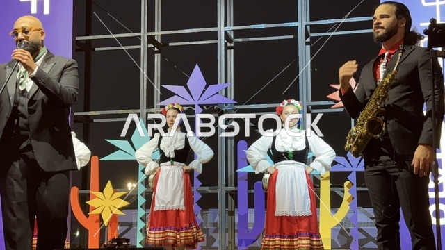 A Mexican folkloric dance at a food festival in the outdoor Ithra Gardens in Dhahran, Eastern Province, Saudi Arabia, on December 28, 2025, a global tasting experience, family-friendly and entertaining atmosphere, enjoyable outdoor seating, international and local restaurants.