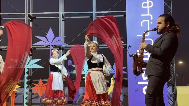 A guitar performance and a Mexican folkloric dance at a food festival in the Ithra outdoor gardens in Dhahran, Eastern Province, Saudi Arabia, on December 28, 2025. A global tasting experience, family-friendly and entertaining atmosphere, enjoyable outdoor seating, international and local restaurants.