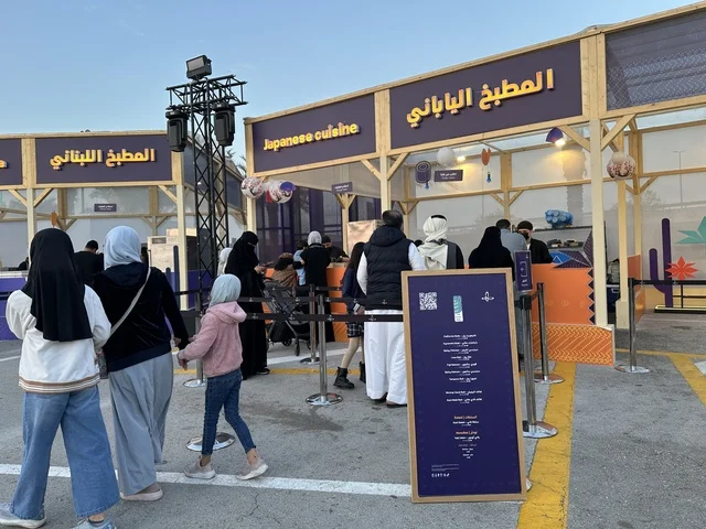 A global tasting experience at international and local restaurants during a food festival in the Ithra outdoor gardens in Dhahran, Eastern Province, Saudi Arabia, on December 28, 2025. Family-friendly and entertaining atmosphere, enjoyable outdoor seating.