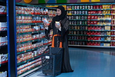 Saudi Woman Shopping in Supermarket with Abaya