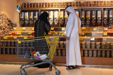 Arab Couple Grocery Shopping in Supermarket