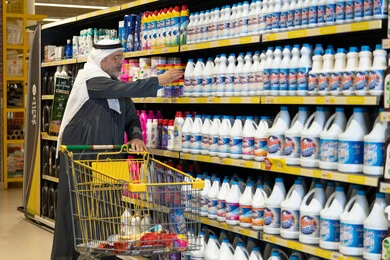 Saudi Man Shopping for Household Products in Supermarket