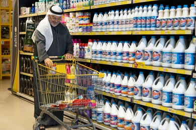 Saudi Man Shopping for Cleaning Products in Supermarket