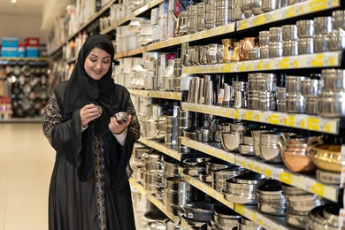 Saudi Woman Shopping for Kitchenware in Retail Store