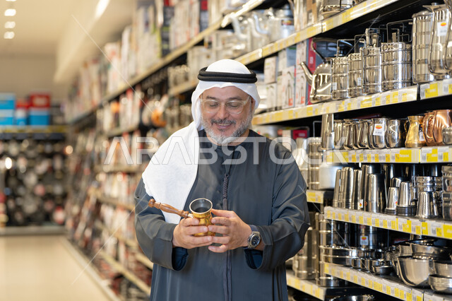 Emirati Man Shopping for Kitchenware in Retail Store