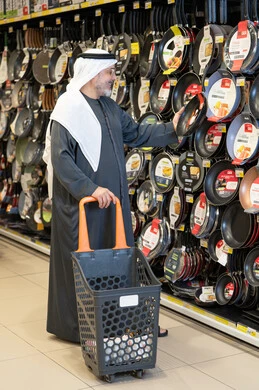 Emirati Man Shopping for Kitchenware in Supermarket