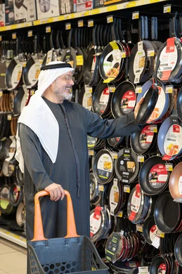 Arab Man Shopping for Kitchenware in Supermarket