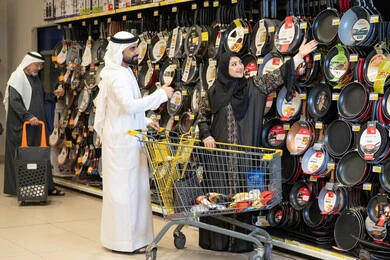 Emirati Couple Shopping for Kitchenware in Supermarket