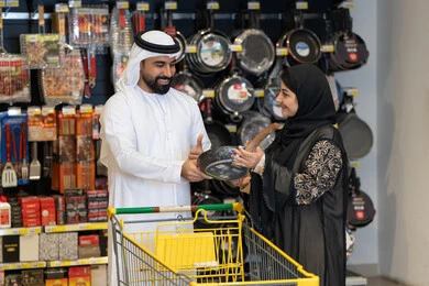 Emirati Couple Shopping for Kitchenware in Supermarket