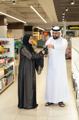 Emirati Couple Shopping for Kitchenware in Retail Store