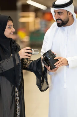Emirati Couple Shopping for Kitchenware in Store