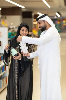 Emirati Couple Shopping for Kitchenware in Store