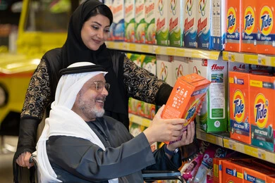 Emirati Man in Wheelchair Shopping at Supermarket