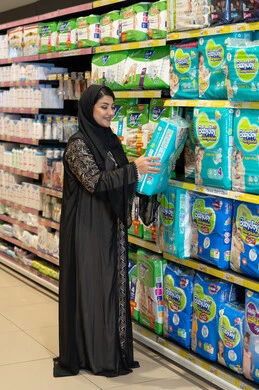 Saudi Woman Shopping for Baby Diapers in Supermarket