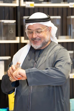 Emirati Man Testing Perfume in Fragrance Shop