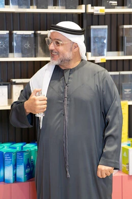Emirati Man Testing Fragrance in Retail Perfume Shop
