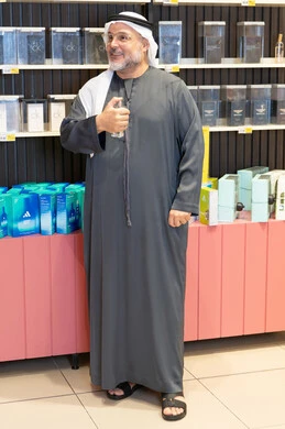 Emirati Man Testing Perfume in Retail Store