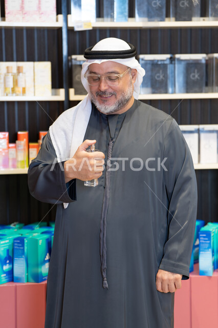 Emirati Man Testing Perfume in Retail Fragrance Shop
