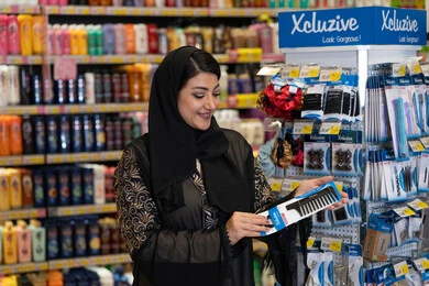 Saudi Woman Shopping for Hair Products in Pharmacy