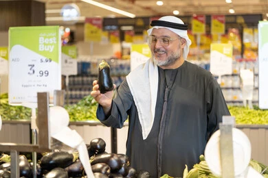 Emirati Man Shopping for Vegetables in Supermarket