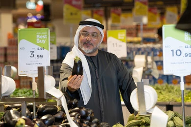 Emirati Man Shopping for Vegetables in Supermarket