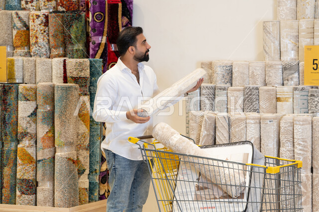 Arab Man Shopping for Carpets in Store Warehouse
