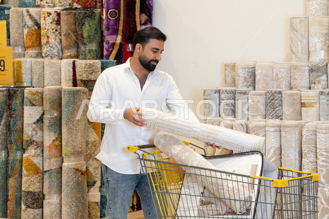 Arab Man Shopping for Carpets in Home Decor Store