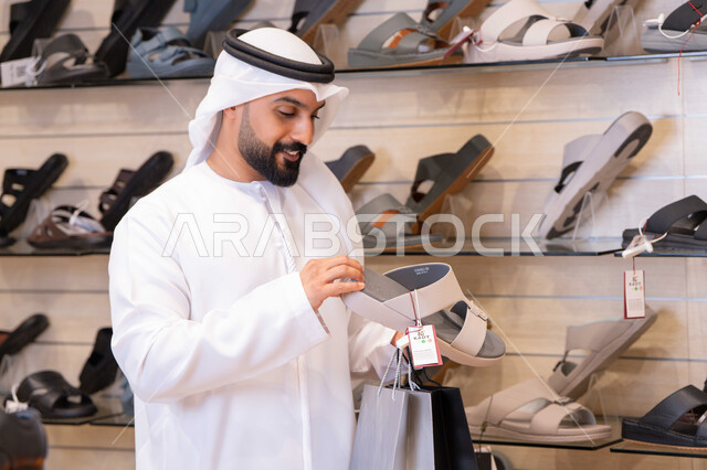 Emirati Man Shopping for Traditional Sandals in Store