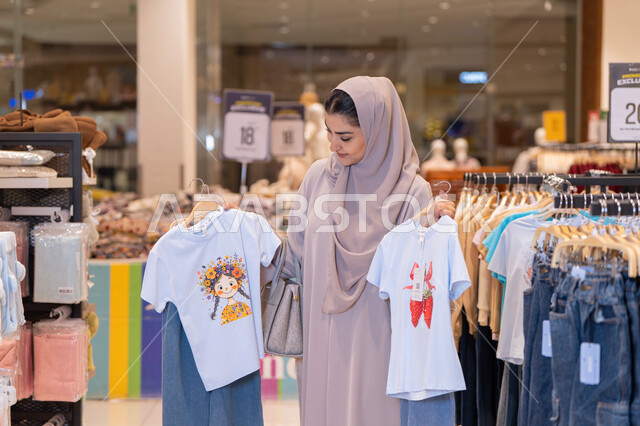 Saudi Woman Shopping for Clothes in Retail Mall