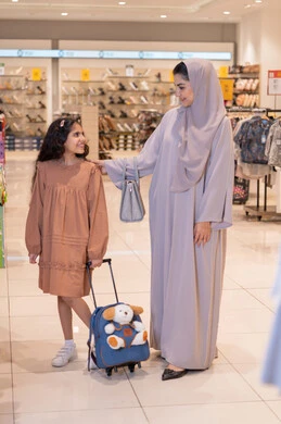 Saudi Mother and Daughter Shopping in Retail Store