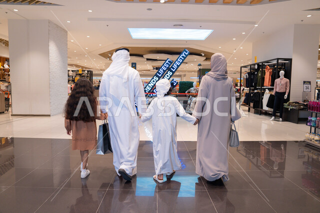 Emirati Family Walking in Modern Shopping Mall