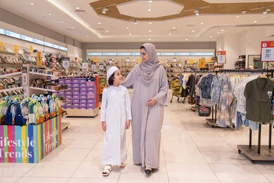 Emirati Mother and Son Shopping in Retail Store