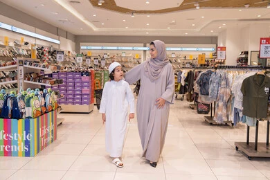 Emirati Mother and Son Shopping in Retail Store