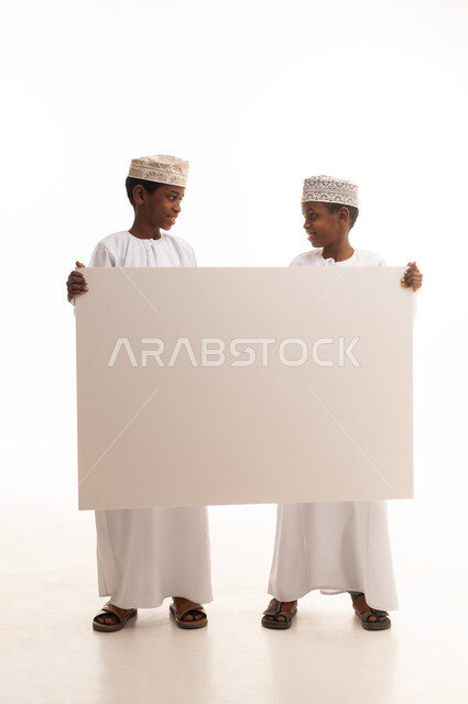 Omani Boys Holding Blank Board on White Background