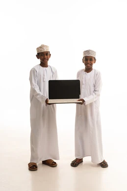 Omani Boys Holding Laptop on White Background