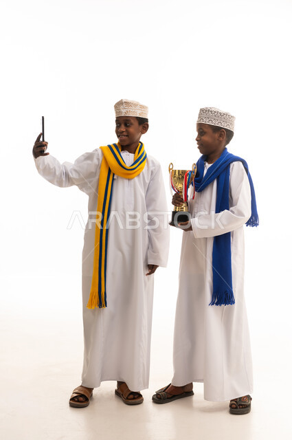Omani Boys with Trophy Taking Selfie in Studio