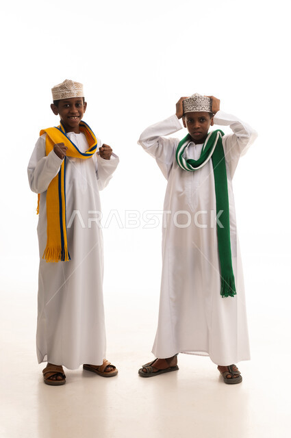 Omani Boys in Traditional Dishdasha on White Background