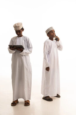 Omani Boys Using Tablet and Smartphone on White Background