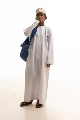 Tired Omani Boy with School Backpack on White Background
