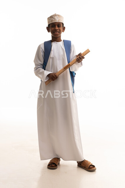 Omani School Boy in Traditional Dishdasha with Backpack