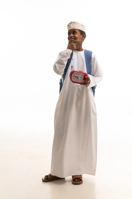 Omani Student with Alarm Clock and Backpack in Studio