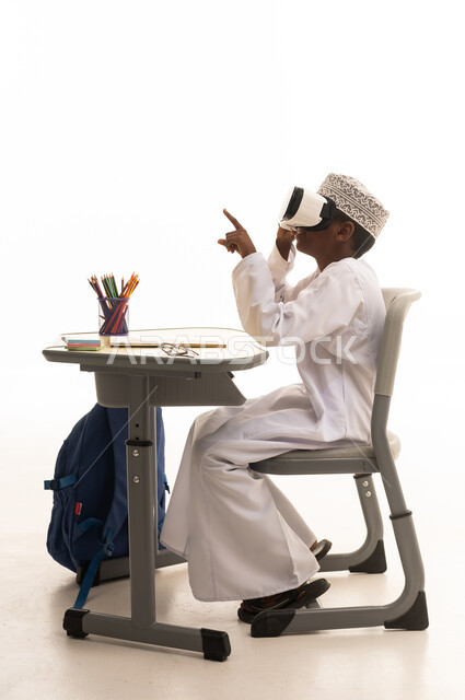 Omani Student Using VR Headset at School Desk Studio